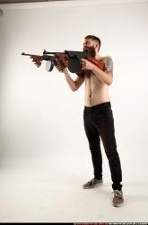 Man Adult Athletic White Fighting with submachine gun Standing poses Pants